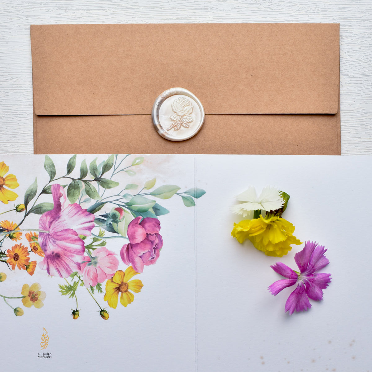 Brown envelope with floral design and wax seal on a white background