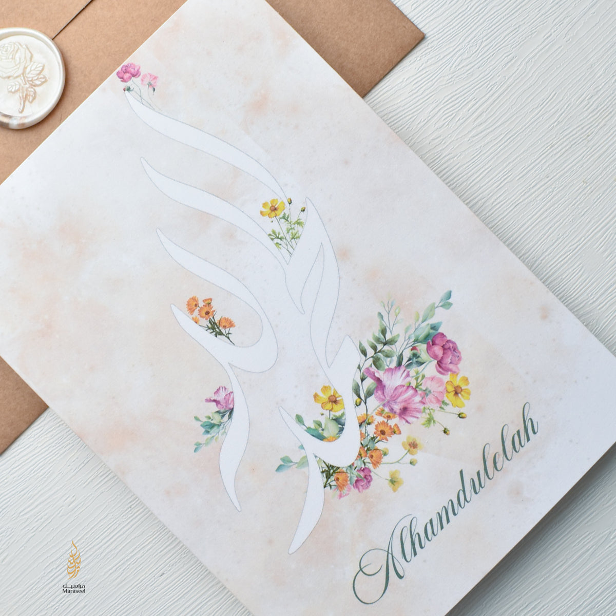 Card with a dove and floral design on a textured surface