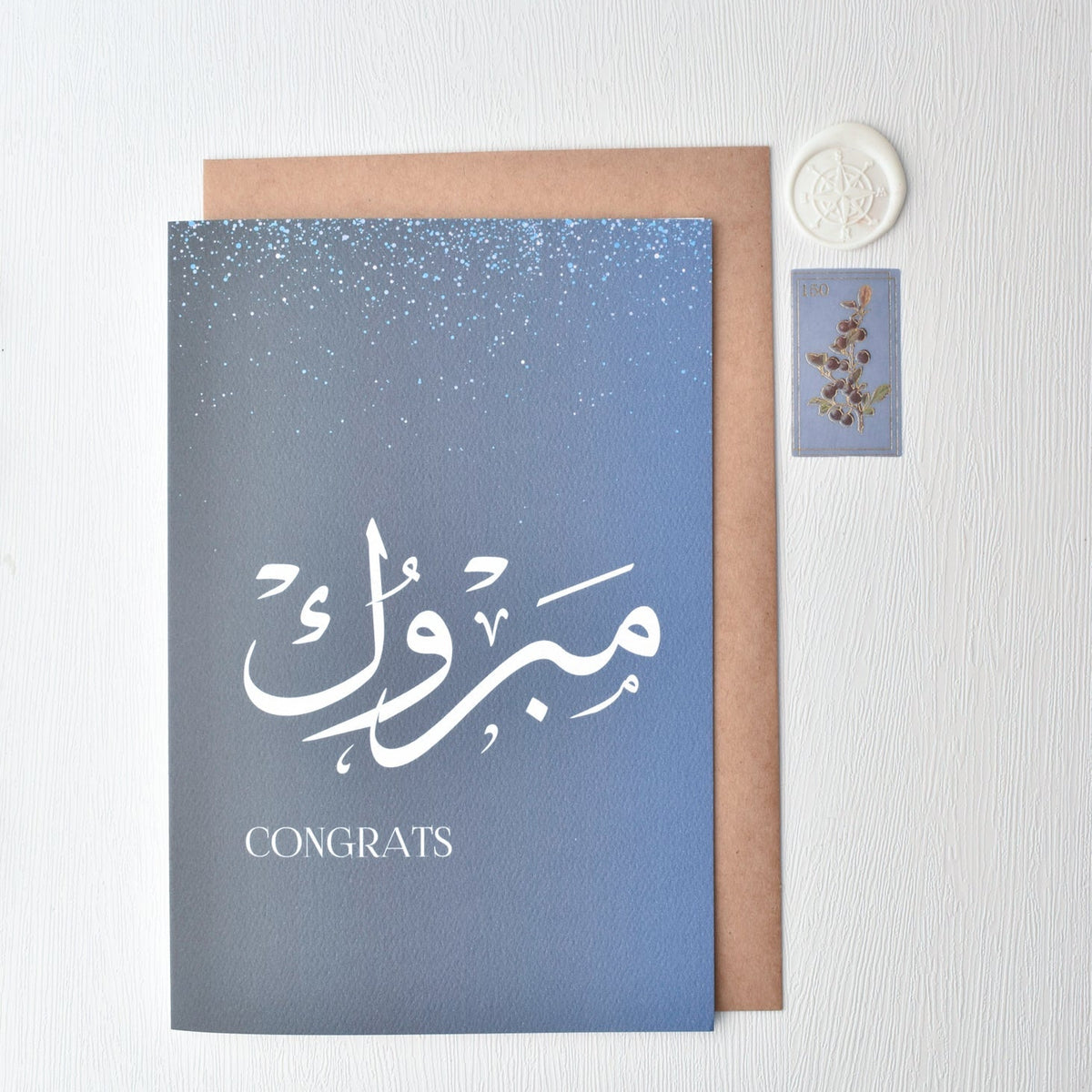 Blue card with Arabic text and 'Congrats' on a white background