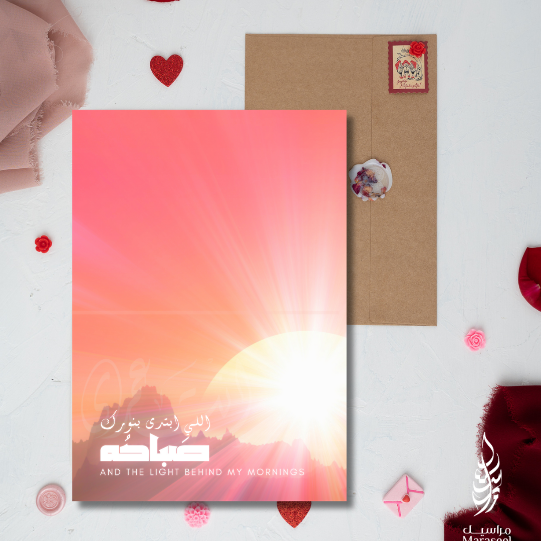 Greeting card with envelope on a white background with red rose petals
