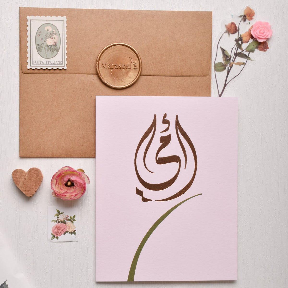 close up of rose gold Arabic calligraphy Ummi design on pink card, Maraseel Cards