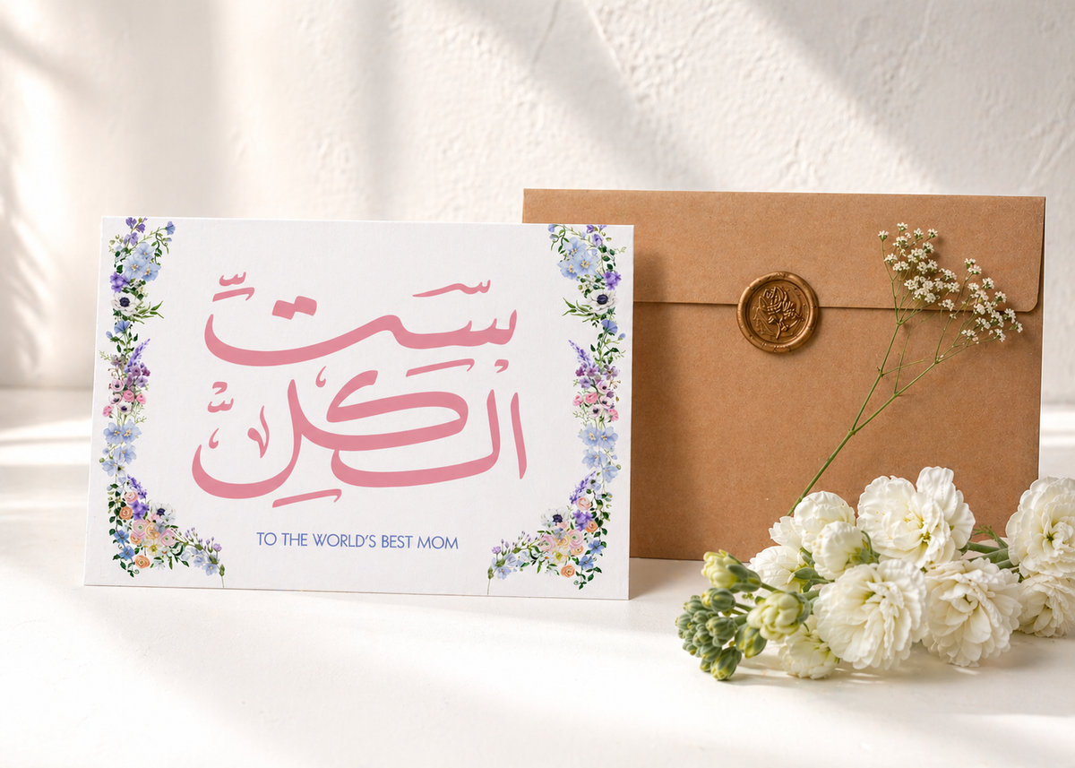 Greeting card with floral design and envelope on a white surface